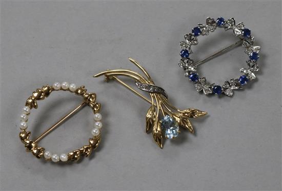 Three 9ct gold and gem set brooches, including white gold.
